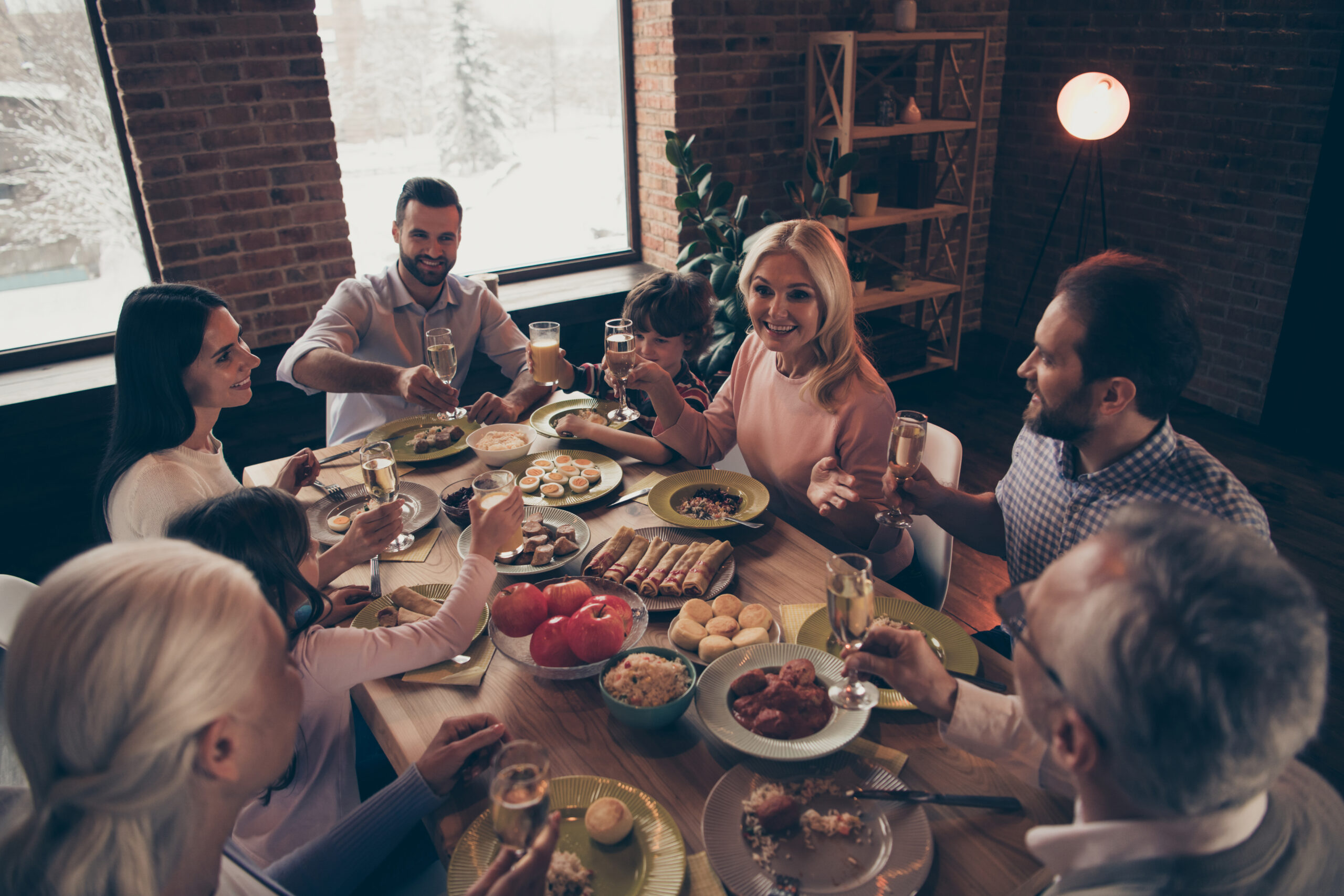 group gathered around a table eating a meal