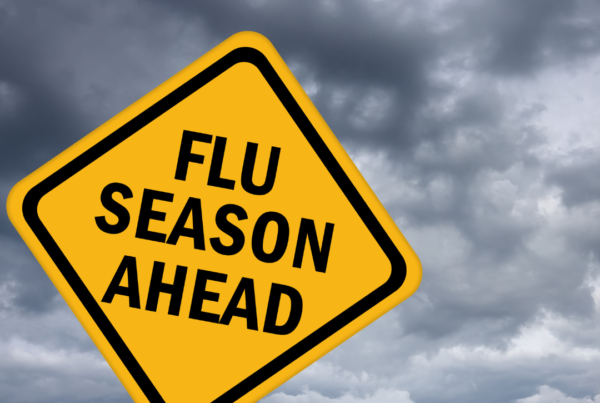 yellow flu season ahead sign with black trim